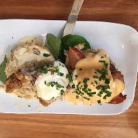Eggs Blackstone · Applewood-smoked bacon & grilled red tomato over a buttermilk biscuit, topped with two poach...