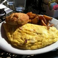 3 Little Pigs Omelet · Applewood-smoked bacon, ham, pork sausage and swiss omelet, served with choice of side and b...