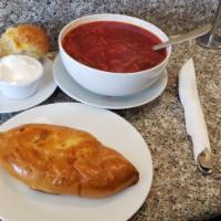 Borscht · Served with sour cream and a side of garlic rolls.