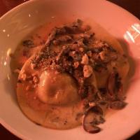 Butternut Squash Ravioli · House made butternut squash ravioli with sauteed mushrooms, cream, white wine topped with cr...
