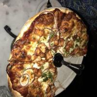 BBQ Chicken Pizza · BBQ chicken, red onions, cilantro, BBQ sauce, and mozzarella cheese.