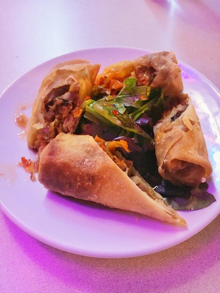 Pulled Pork Spring Rolls · House-smoked pulled pork and fresh vegetables in a crispy egg roll with sweet chili sauce.  Our most acclaimed dish.