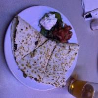 Chicken Quesadilla · Marinated grilled chicken, sautéed peppers and onions, queso blanco, shredded cheddar and ho...