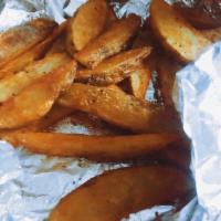 Potato Wedges · Crispy oven fresh seasoned potato wedges. (12 oz)