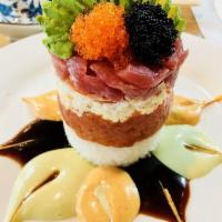 Ahi Tuna Tower Roll · Raw. Tuna, crab salad, spicy tuna, avocado, 3 kinds of tobiko, fresh salsa, sushi rice, unag...