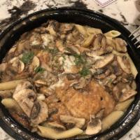 Chicken Marsala · Served with sauteed mushrooms in sweet marsala wine. served over penne