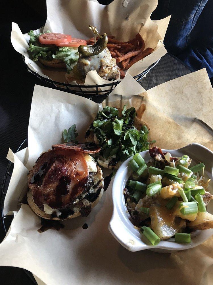 The Angry Goat Burger · 1/2 lb burger, caramelized onions, pancetta, herbed goat cheese, fresh arugula, balsamic glaze and garlic aioll on a brioche roll.