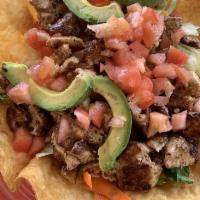 Tostada Salad · Choice of steak or chicken breast with tossed greens, beans, cheese, cabbage, carrots and sl...