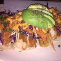Baja Fish Tacos · 4 beer battered swai fish tacos, served with chipotle aioli, cilantro, red cabbage and pickl...