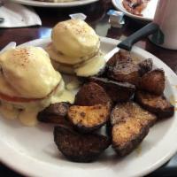 Traditional Eggs Benedict · 2 poached eggs served on an English muffin with Canadian bacon, hollandaise, and our home fr...