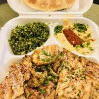 Lemon Chicken Plate · Pieces of chicken breast come with,lemon-flavored sauce. Served with pita and hummus.and salad