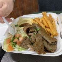 Gyros Plate · mix Lamb and beef served in the plate with hummus,salad and pita bread