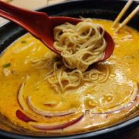 Northern Style Curry Noodle Soup · Egg noodle and bean sprout in a red curry broth, top with red onion, scallion, pickled musta...
