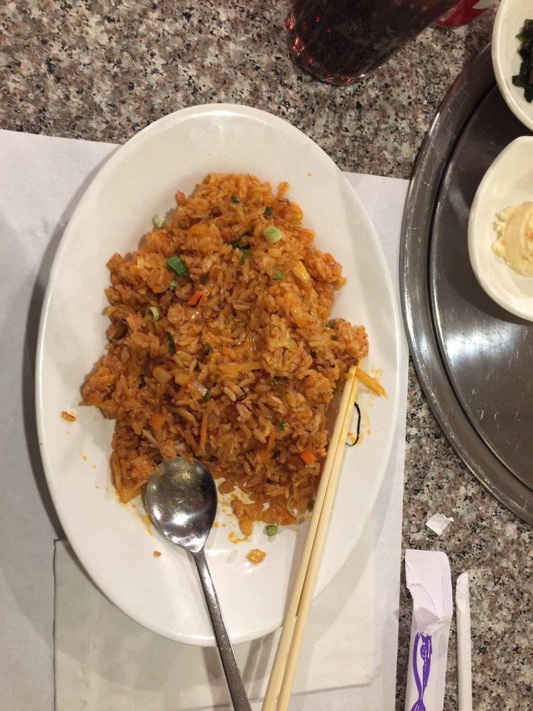 Kimchi Fried Rice · Wok-tossed with kimchi, carrots, onions and topped with fried egg.