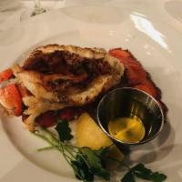 Twin Lobster Tails · Two lobster tails grilled and served with drawn butter. 