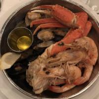 Cajun Seafood Boil · Snow crab legs, clams, mussels and jumbo shrimps boiled in beer and Cajun spices.
