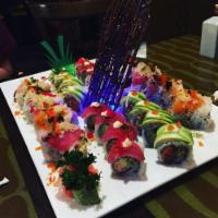 Treasury Roll · Real crab meat and avocado, cucumber topped with tuna, salmon, yellowtail, escolar, caviar a...