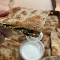 Chives Bolani · House special. Fresh flatbread filled with chives and spices, served with a yogurt sauce on ...