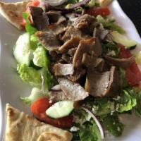 Gyros Salad · A hearty mixed green salad with fresh tomatoes, onions, cucumbers, feta cheese, Kalamata oli...