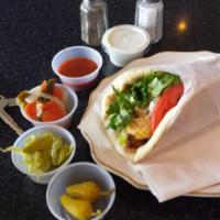 Chicken Kabob Sandwich · Skewer of marinated charbroiled boneless chicken, stuffed in pita with lettuce, sliced tomat...