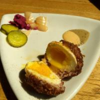 Scotch Egg · Sausage wrapped soft-boiled egg breaded then deep fried, served with Guinness-mustard