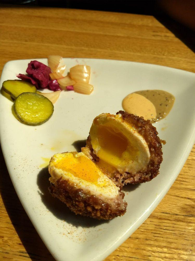 Scotch Egg · Sausage wrapped soft-boiled egg breaded then deep fried, served with Guinness-mustard