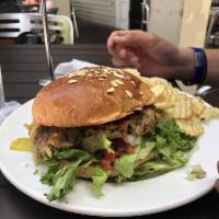 Veggie Burger · Homemade vegetable patty topped with avocado, fresh pico de gallo, feta cheese, green leaf l...