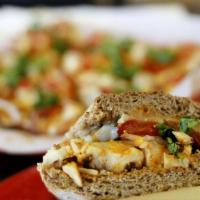 Stephen Curry · Grilled chicken breast, homemade curry sauce, pepper jack cheese, tomatoes, onions and cilan...