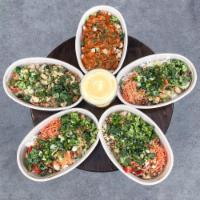 Quakes Bowl · Topped with steamed broccoli, carrots, green onions, cilantro, roasted bell peppers, basil a...