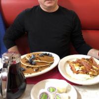 Hungry Man Special · 2 Pancakes & 2 eggs with ham, bacon or sausage add potato $1.00,  toast. for add $1.00, add ...