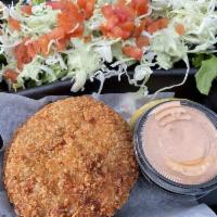 Crab Cakes · With a garnish salad, lime aioli and chipotle mayo.