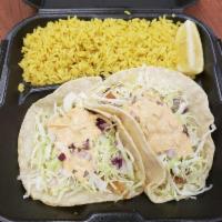 2 Grilled Mahi Mahi Taco Plate · With cabbage, cilantro, tomato, red onion and chipotle dressing.  Served with black bean sal...