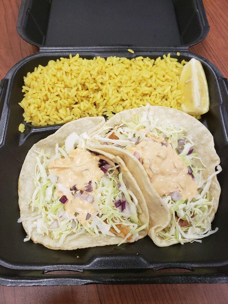 2 Grilled Mahi Mahi Taco Plate · With cabbage, cilantro, tomato, red onion and chipotle dressing.  Served with black bean salsa and pilaf rice.