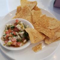 White Fish Ceviche Tostada · 2 pieces.  Tostada topped with ceviche and avocado.