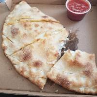 Calzone · Ricotta, mozzarella and 2 toppings.