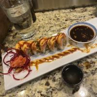 Mexican Roll · Eel, fried crab, avocado, topped with spicy tuna, spicy mayo, eel sauce and Sriracha.