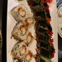 Under Sea Monster Roll · Spicy tuna, cucumber, topped with 1/2 of whole eel, seaweed salad and 2 types masago.