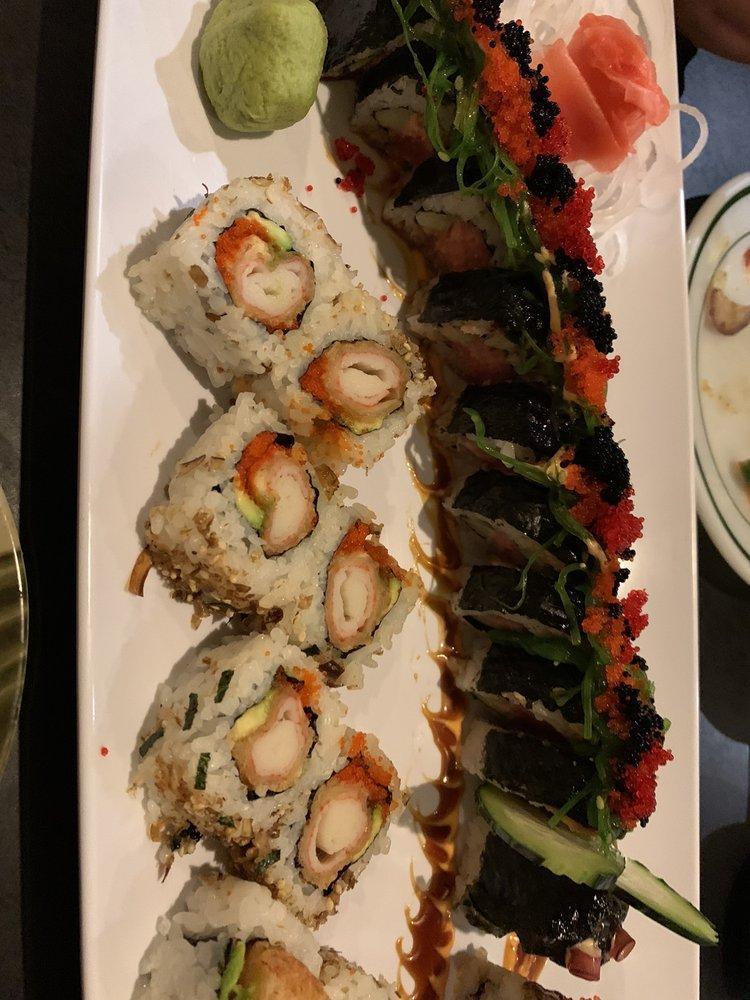 Under Sea Monster Roll · Spicy tuna, cucumber, topped with 1/2 of whole eel, seaweed salad and 2 types masago.