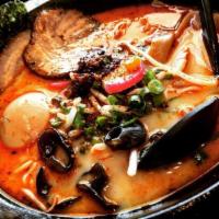 Tonkotsu Ramen · Roasted pork, boiled egg, kikurage mushroom, bamboo shoots, green onion, sprouts and fish ca...