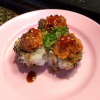 Volcano Roll · 8 pieces. California roll base with seared spicy salmon on top torch and teriyaki sauce, sri...
