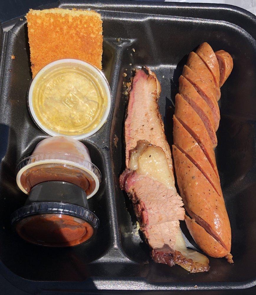 2 Meat Combo · Any combination of chicken, pulled pork, or sausage. Substitute ribs for any one selection for an additional $2.25, substitute brisket for an additional $1.00. Includes 2 sides.