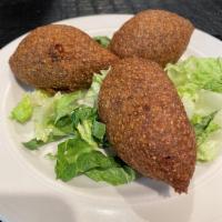 Kibbeh · Fried bulgur and meat shells stuffed with a mixture of (beef or chicken) onion, pine, nuts, ...