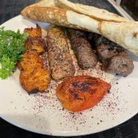 Aladdin Mixed Grill Platter · Combination of beef kabob, chicken kabob, chunk of beef, and chicken.