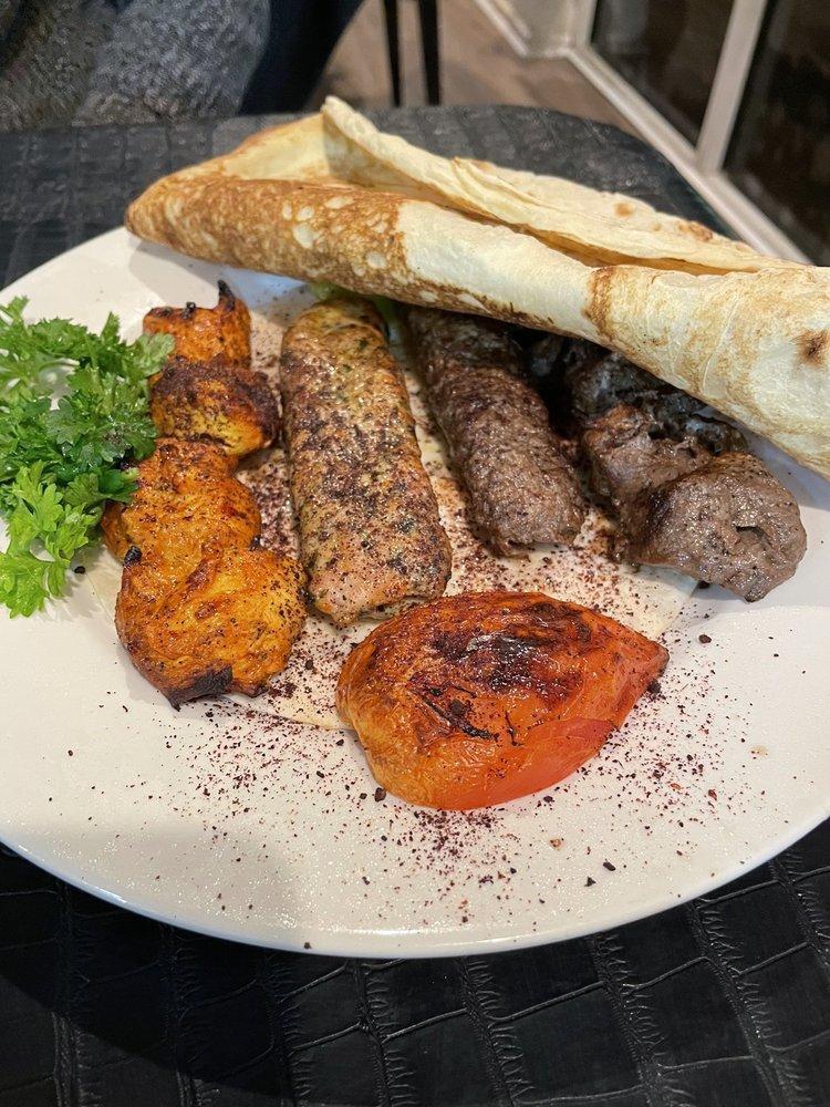 Aladdin Mixed Grill Platter · Combination of beef kabob, chicken kabob, chunk of beef, and chicken.
