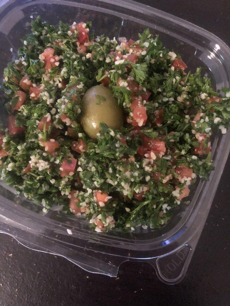 Tabbouleh · Fresh parsley mixed with tomato, bulgur, onion, lemon juice, and olive oil.