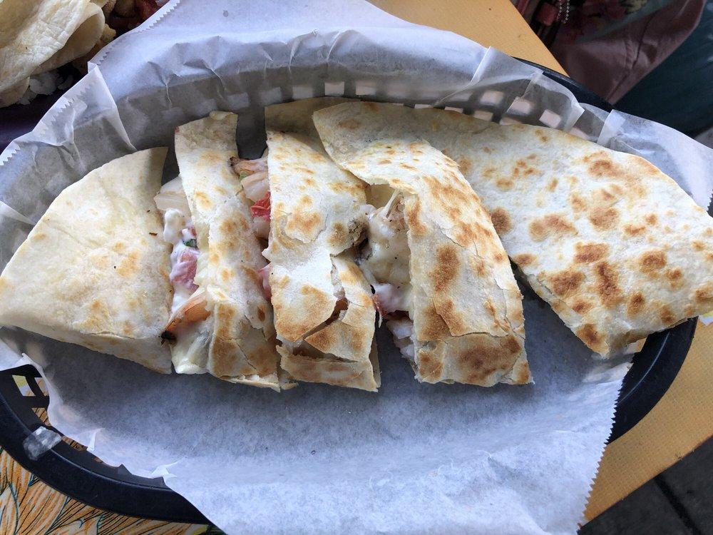 Grilled Shrimp Quesadilla · Grilled tiger shrimp layered with crema agria, melted jack cheese & pico de gallo in a lightly toasted our tortilla served with a ramekin of salsa and a handful of chips.