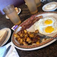 Chuck Wagon Grand Slam · 2 large eggs, bacon or sausage, home fries or grits, country style sausage gravy and toast o...