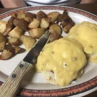 Eggs Benedict · Served with home fries or grits.