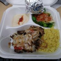 Shawarma Platter · Not a sandwich! Marinated chicken, beef, or lamb grilled to perfection and topped with saute...