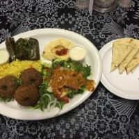 Vegetarian Platter · Three falafel patties served with tahini sauce and 3 stuffed grape leaves served with yogurt...